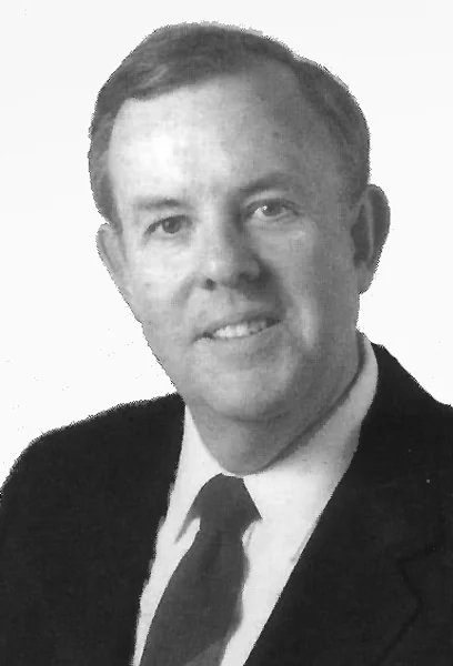 Black-and-white portrait photograph of Robert W. Bob LaFraugh, the type of photo that can be engraved into a bronze conference room dedication plaque.