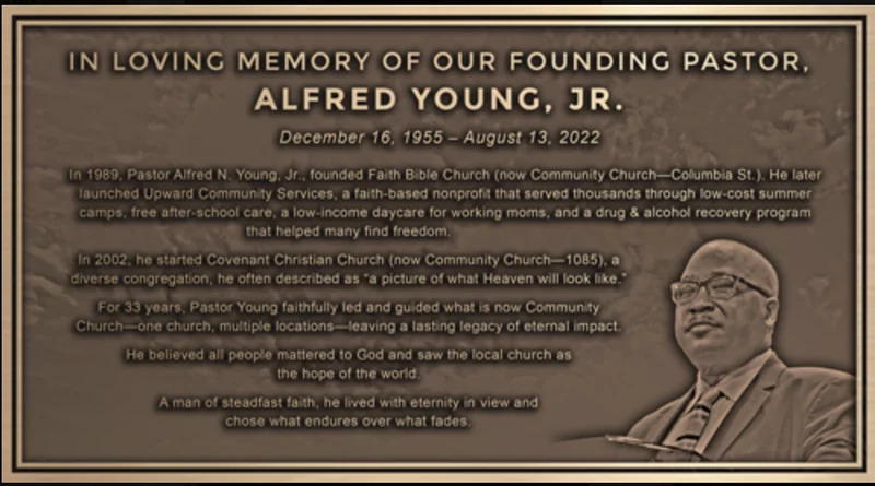 Bronze memorial plaque for founding pastor Alfred Young Jr. with an engraved portrait and a tribute to his ministry.