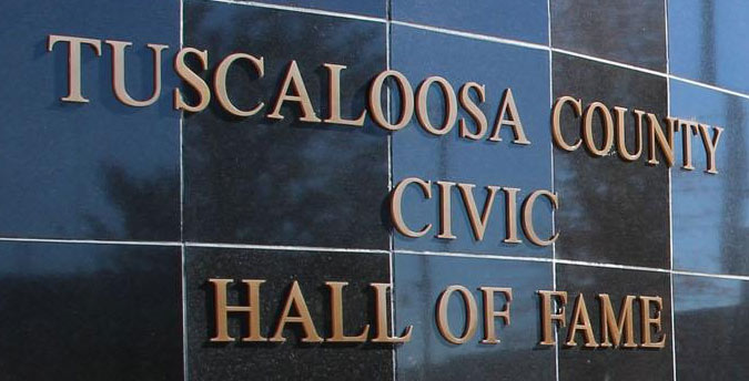 Bronze metal letters on a wall for a civic hall of fame
