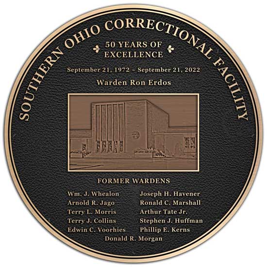 A circle shaped bronze used for a new correctional facility dedication plaque.
