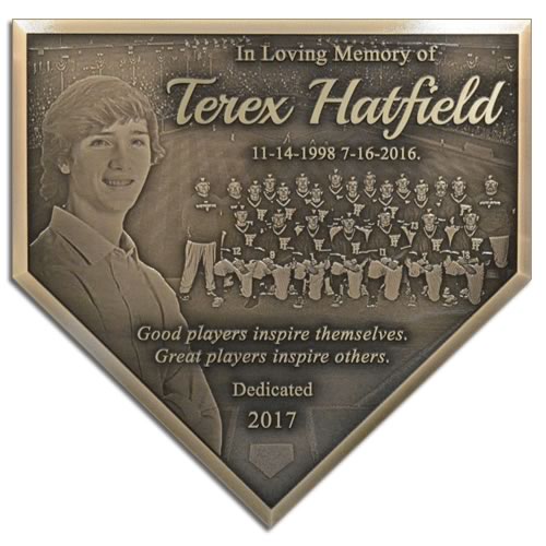 A baseball field dedication plaque to honor the memory of a teammate who passed away.