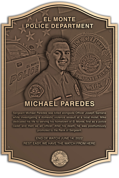 A bronze police memorial plaque listing officer names.