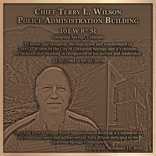 A bronze plaque dedicating a new police station.